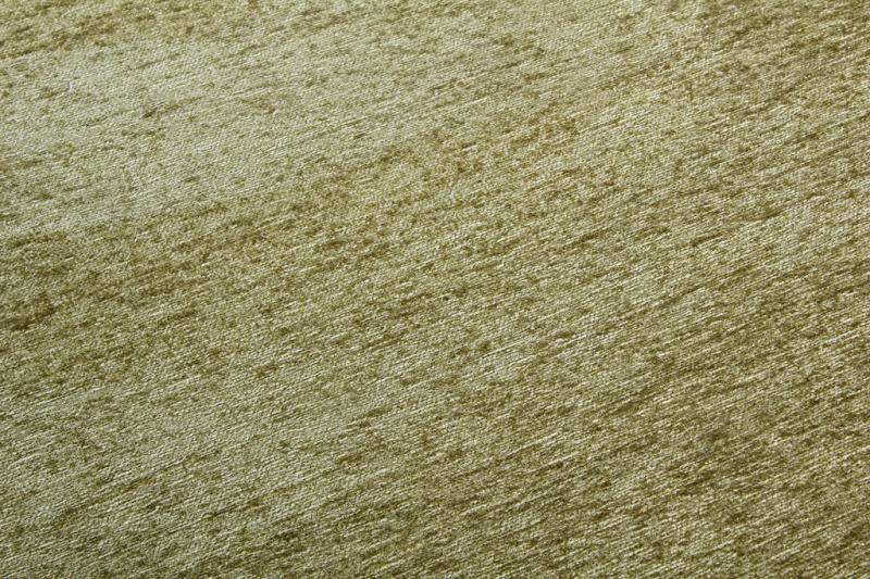 Moretti Plain Rug placed in a tranquil reading nook, adding warmth and simplicity to the space.