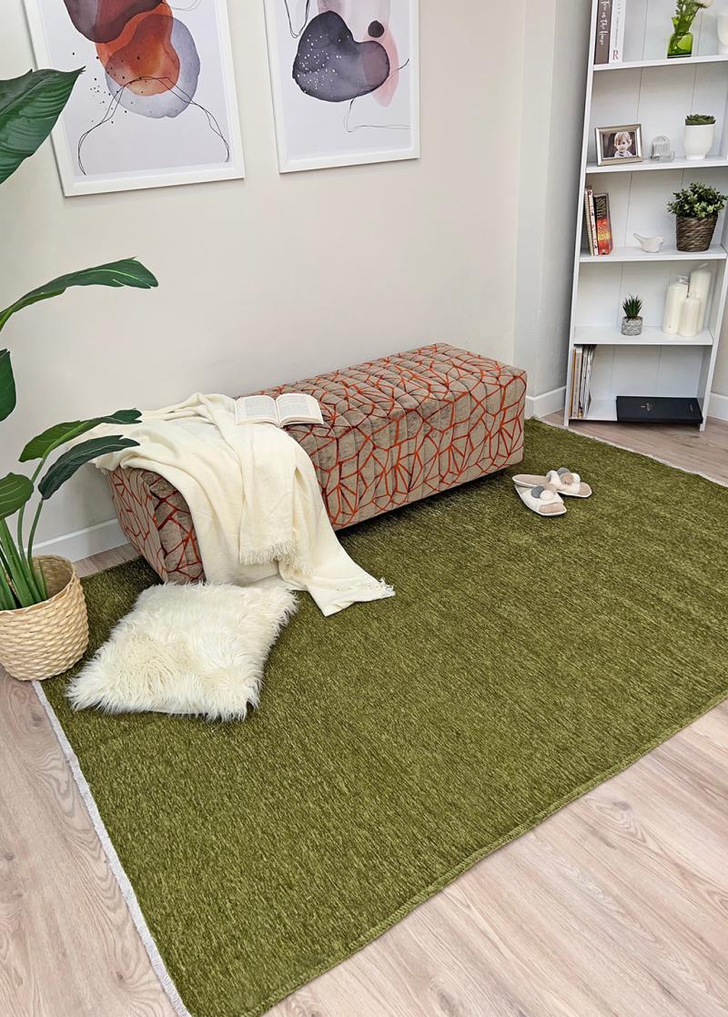 Moretti Plain Rug placed in a tranquil reading nook, adding warmth and simplicity to the space.