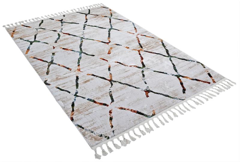 White rug with colorful abstract geometric pattern and tassels