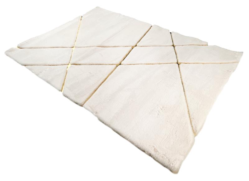 Close-up of Rabbit Fur Rug's delicate fibers, highlighting the elegance of the cream and gold fur.