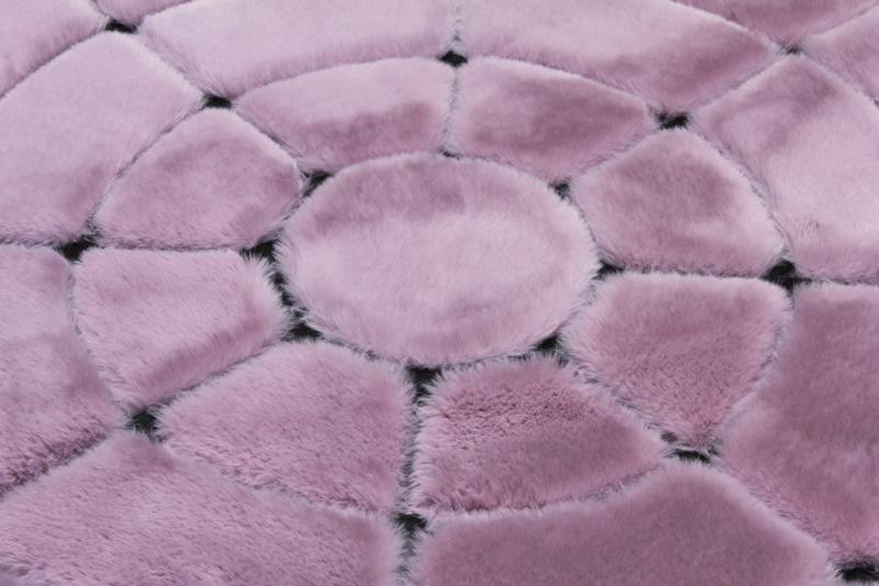 Close-up of Rabbit Round Fur Rug's plush fibers, showcasing the elegance of the rose and black fur.
