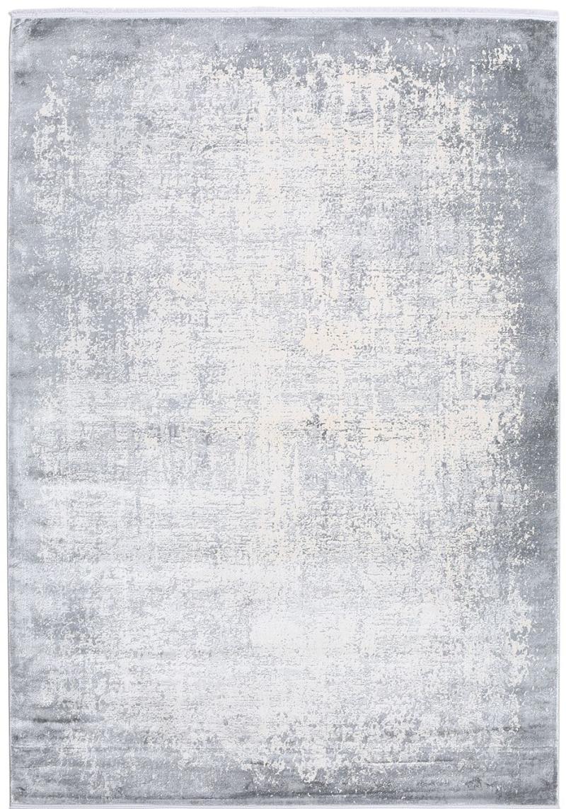 Overhead view of gray and white abstract patterned area rug