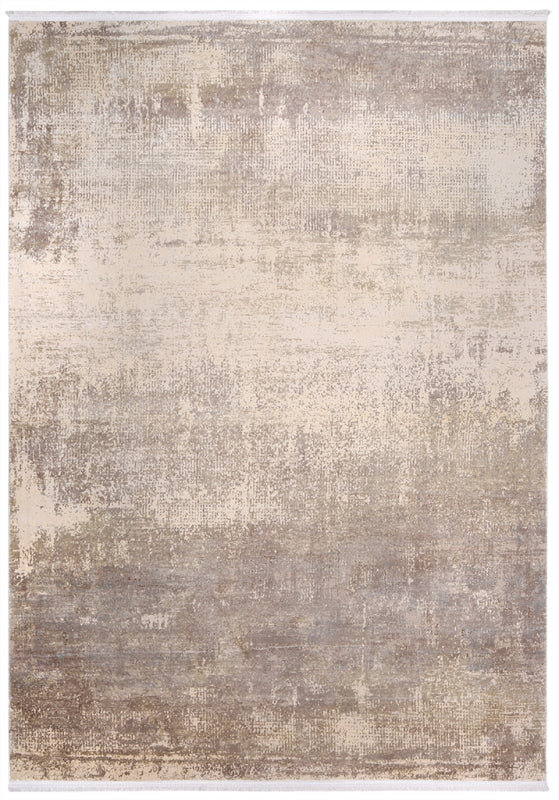 Overhead view of abstract beige and brown area rug with fringe.