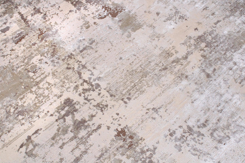 Close up view of abstract patterned rug in neutral colors