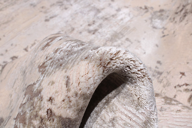 Close-up beige abstract pattern rug texture rolled edge