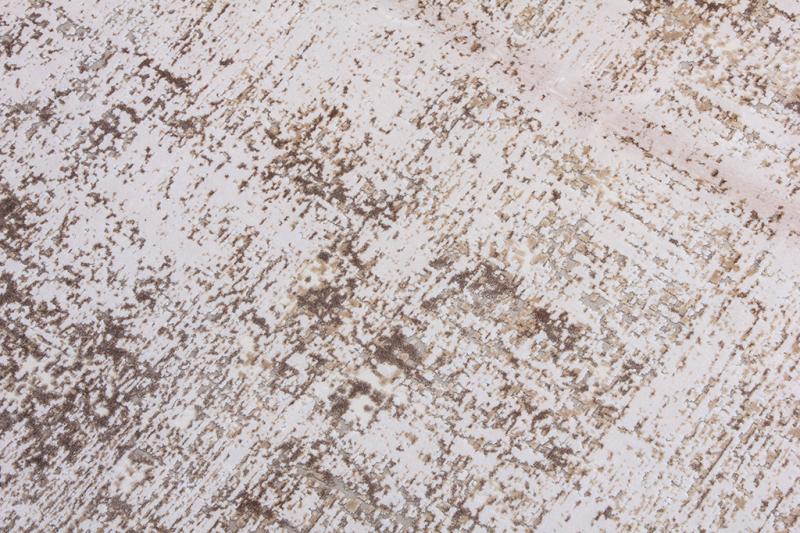 Close up view of white and brown abstract patterned rug texture