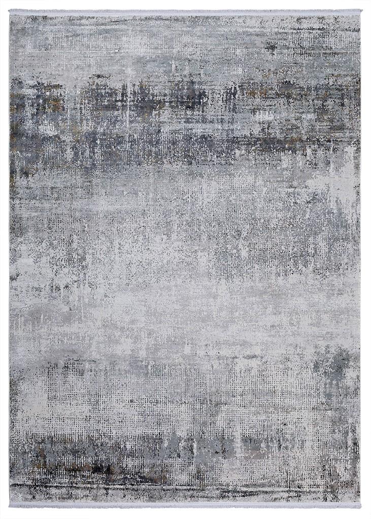 View of abstract gray and white area rug with distressed pattern