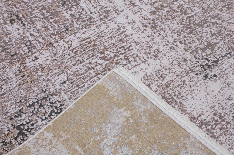Lexus Rug placed in a living room setting, enhancing the space with its warm brown tones and elegant design.