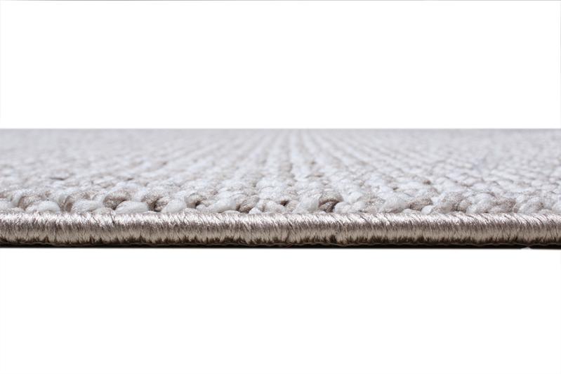 Close up view of gray and white woven rug edge