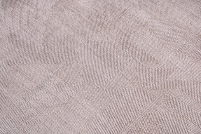Infiniti Rug placed in a living room setting, adding warmth and elegance with its subtle beige tones.
