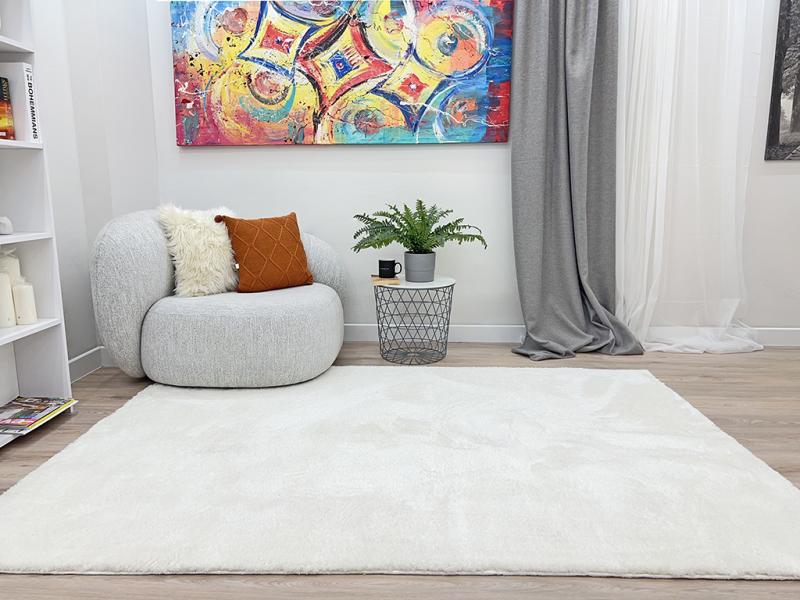 Angled view of Tampa Shaggy Rug under a coffee table, showcasing its seamless fit into cozy interiors.