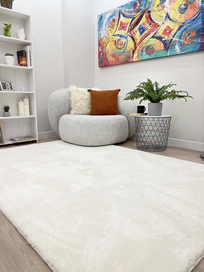 Angled view of Tampa Shaggy Rug under a coffee table, showcasing its seamless fit into cozy interiors.