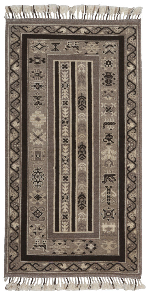 Overhead view gray and brown patterned rug with fringe on ends.