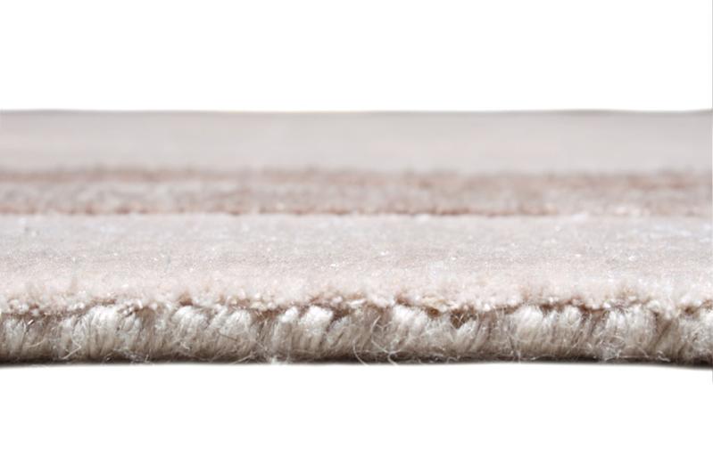 Angled view of Cornelli Rug under a stylish coffee table, demonstrating its seamless integration into modern interiors.