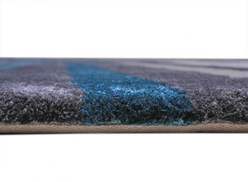 Close up view of gray and blue striped rug edge