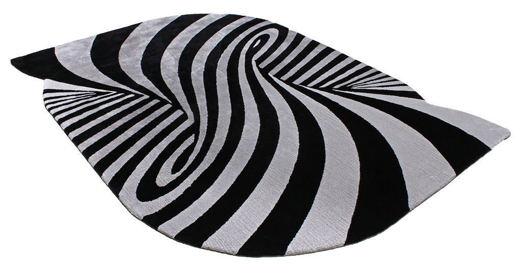 Black and white striped area rug with optical illusion design