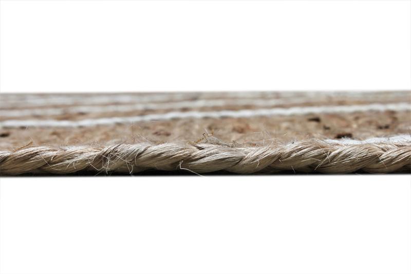 Close up view of braided jute rug edge showing texture
