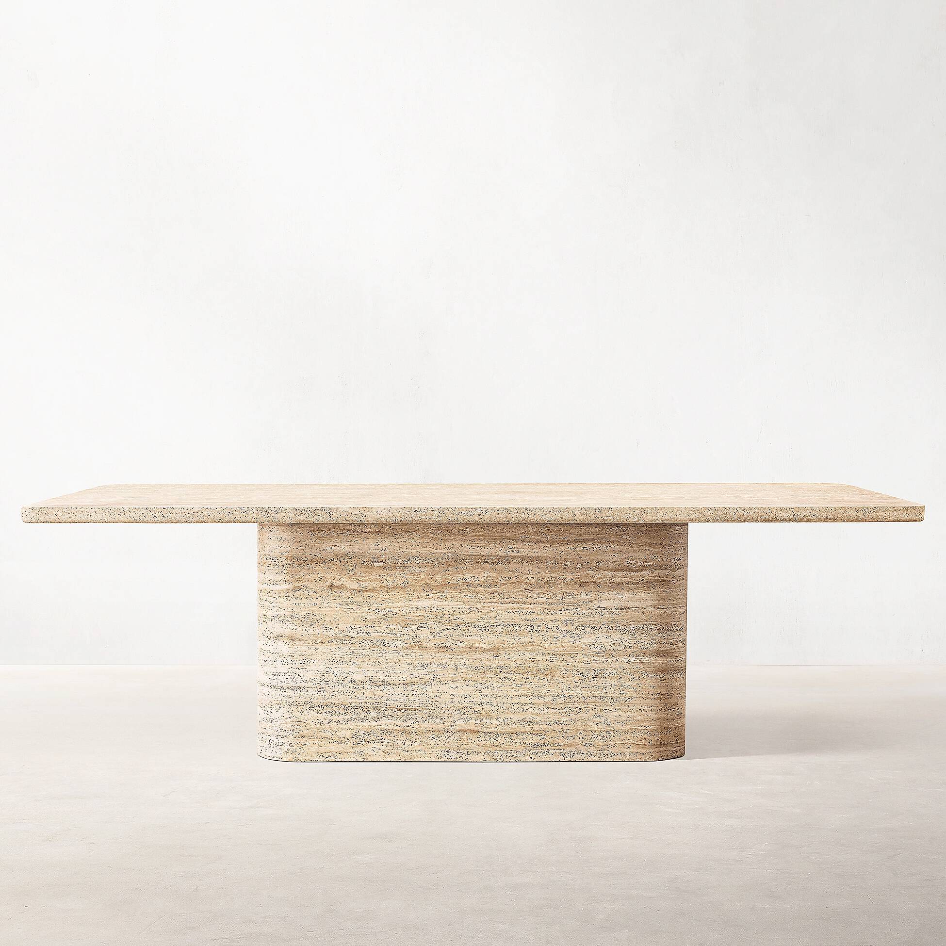 Luzione Sukh Wide Leg Travertine Dining Table: Minimalist design with natural stone texture, ideal for contemporary living spaces