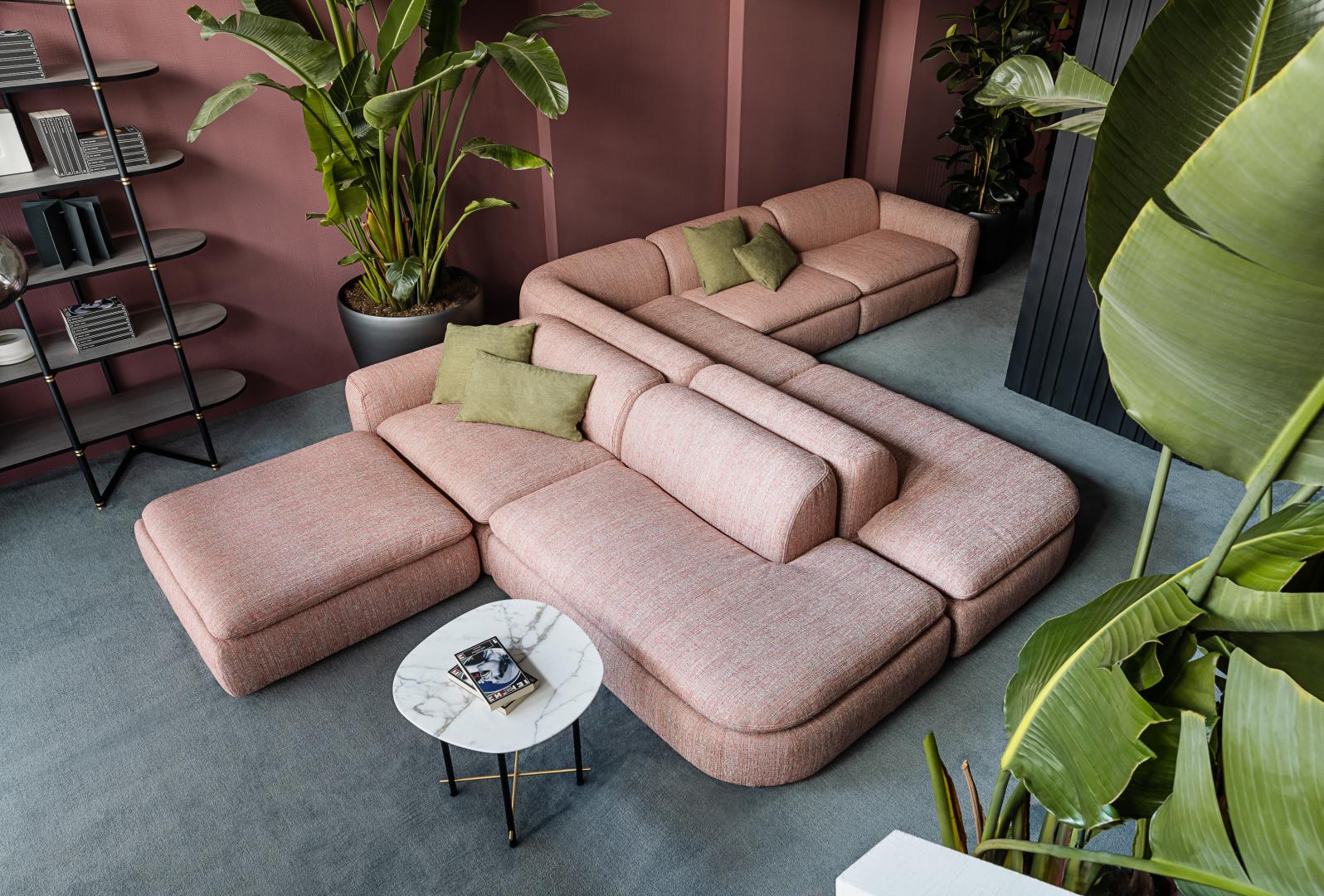 The Casamilano Botero sofa, showcasing its elegant curves and plush cushions, offers a luxurious seating experience in a modern living space