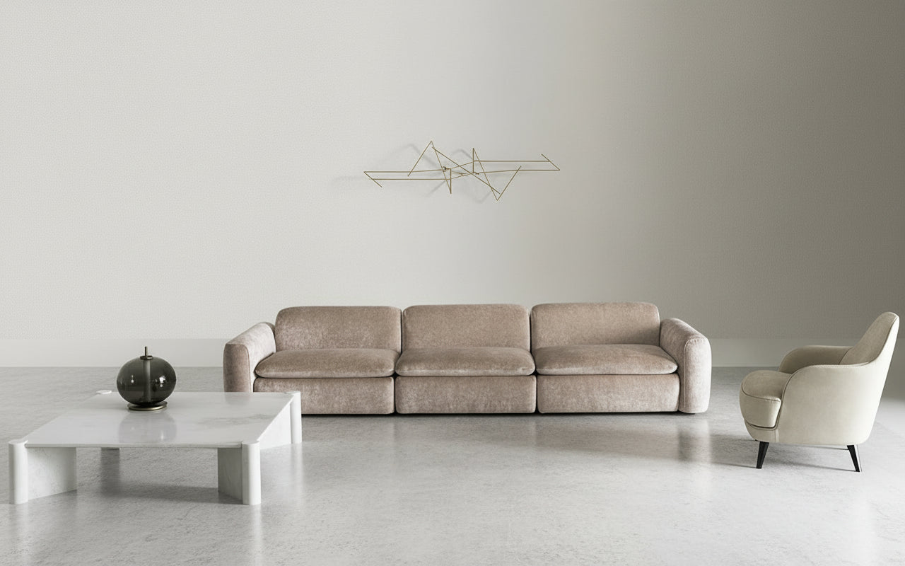 Modern living room featuring a Casamilano Botero modular sofa, marble coffee table, and accent chair, showcasing contemporary interior design