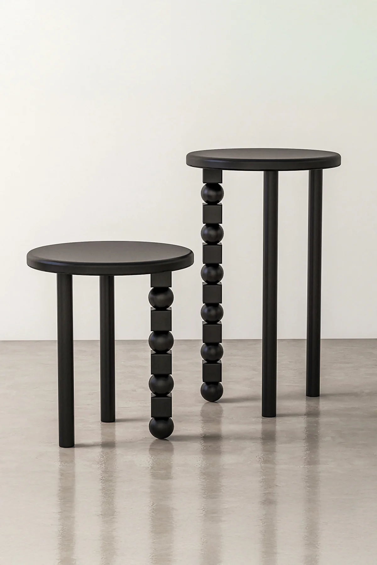 Abacus side table in chestnut wood veneer with matte black lacquer finish.