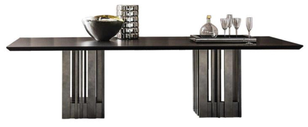 Casamilano Empire dining table with dark wood top, pedestal base, styled with decorative objects, luxury modern furniture