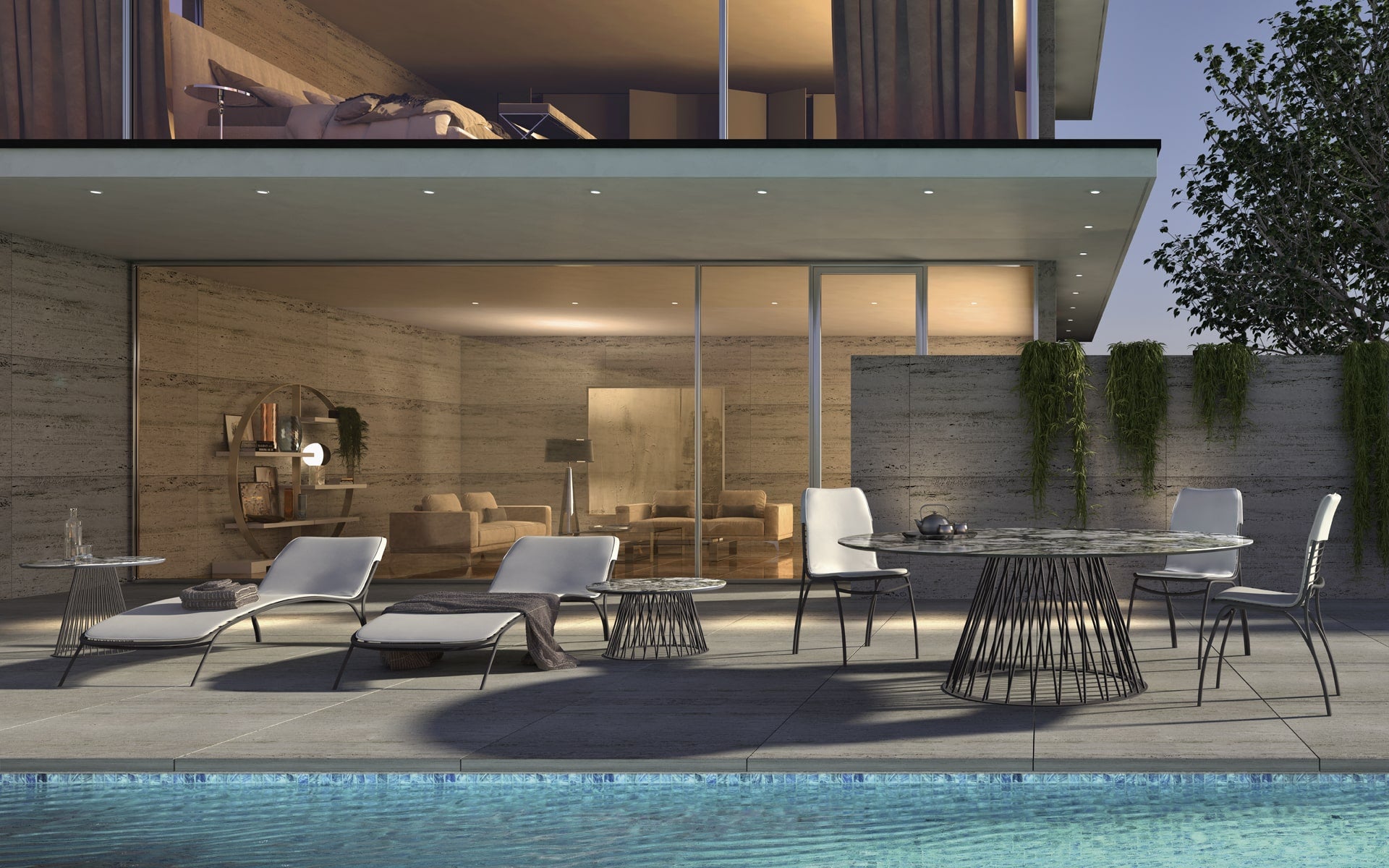 Modern outdoor furniture poolside at luxury home with lounge chairs.