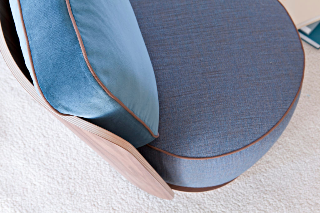 Overhead view of blue fabric chair seat and back cushion