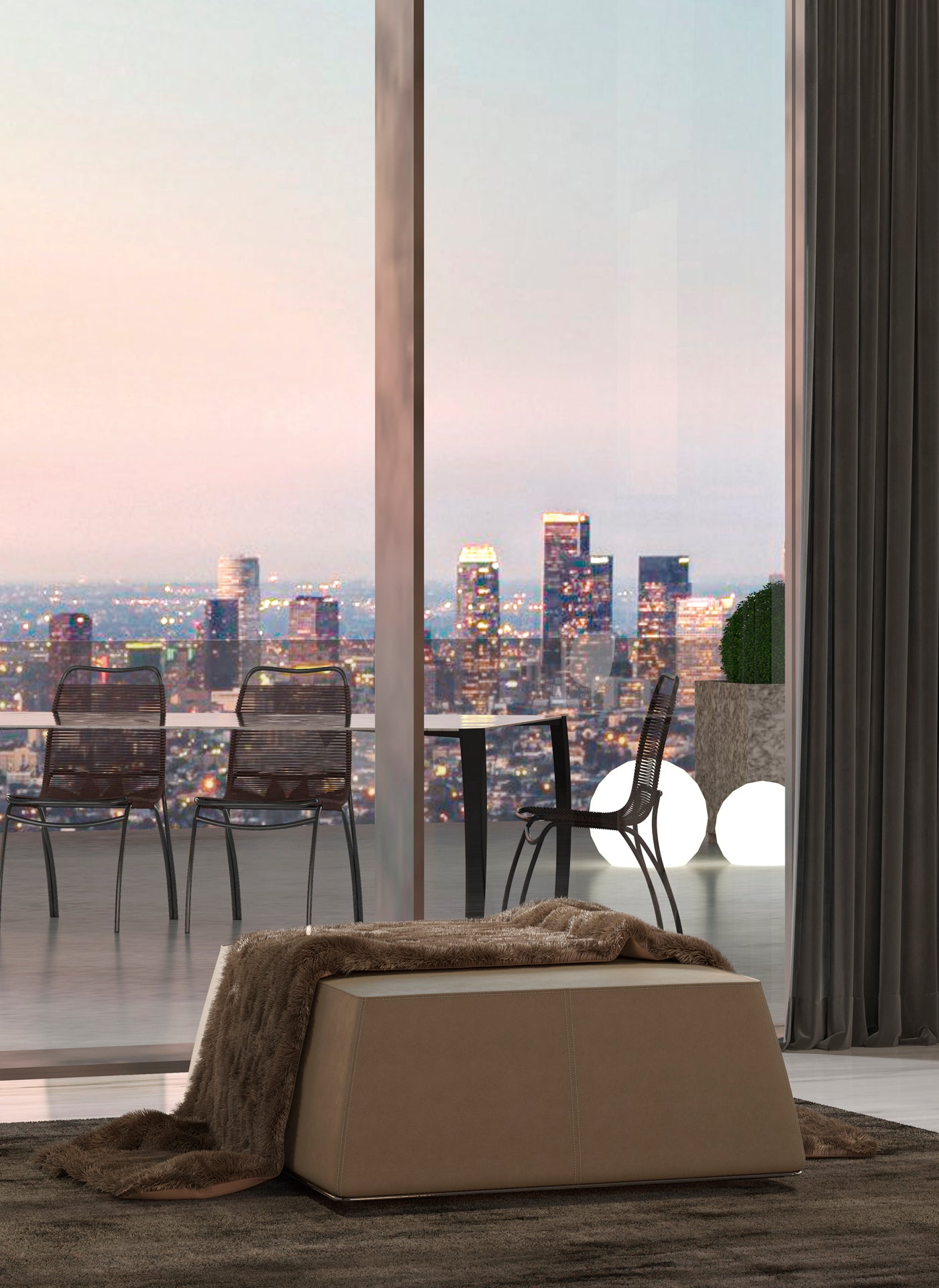 View of city skyline from balcony with beige leather ottoman, chairs, table