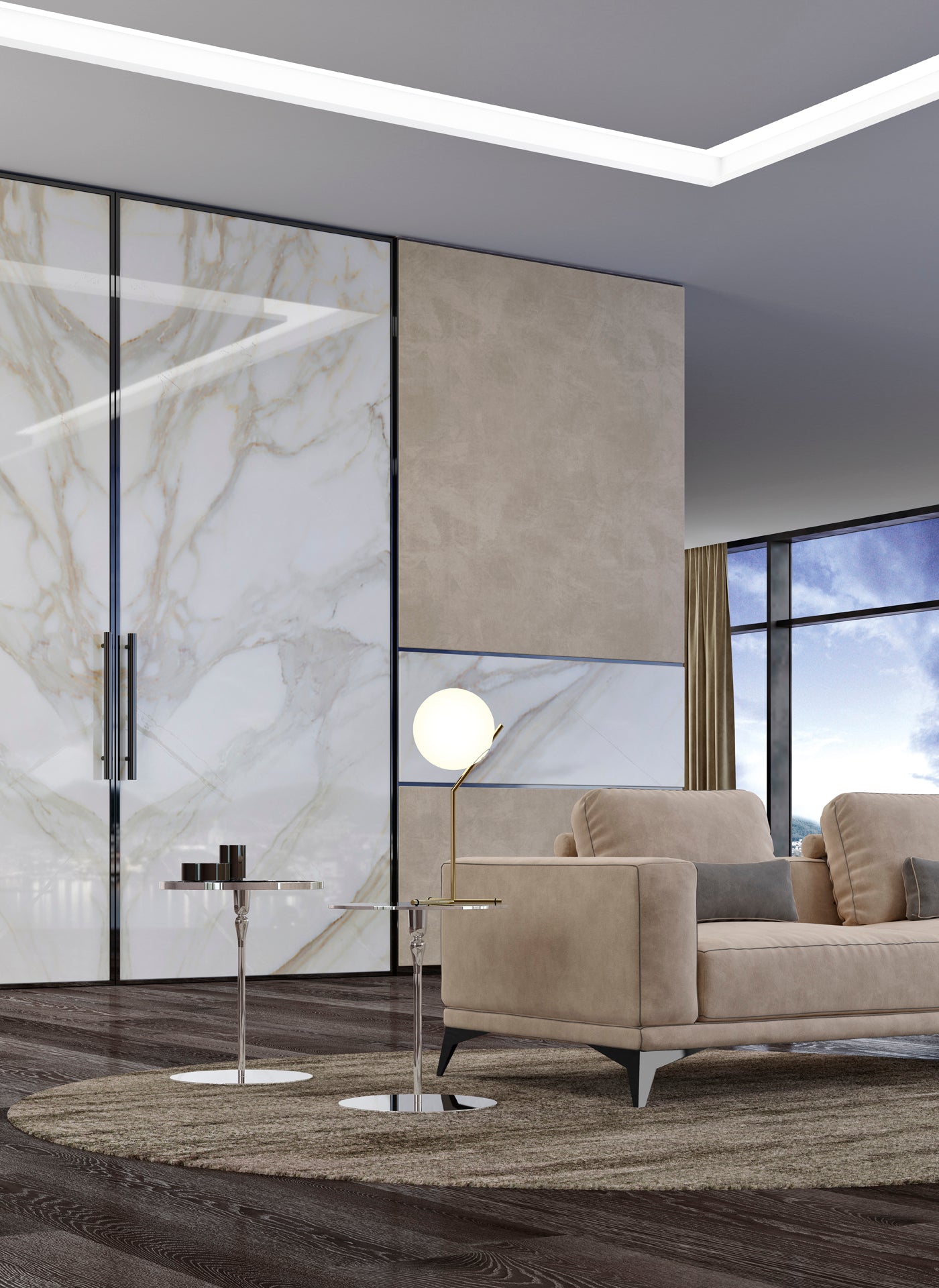 View of beige sofa, two chrome side tables, and gold floor lamp