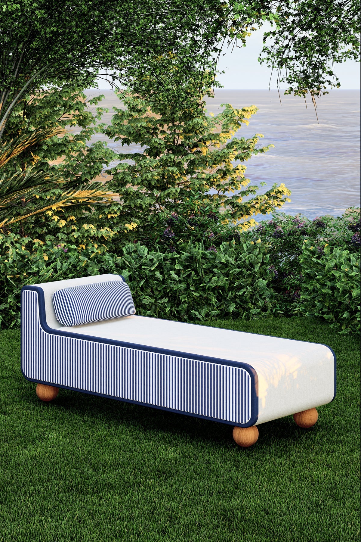 Modern outdoor chair with striped pattern on grass near a body of water