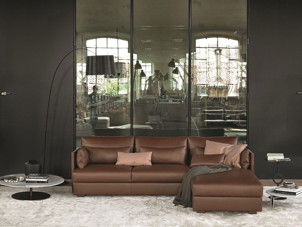 Brown leather sectional sofa with chaise lounge and arc lighting
