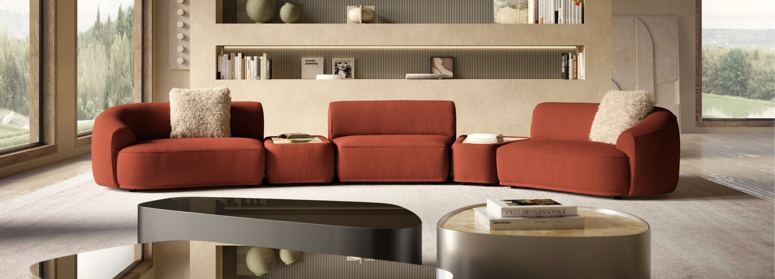 Red sofa in a modern living room with large windows and a neutral color palette.