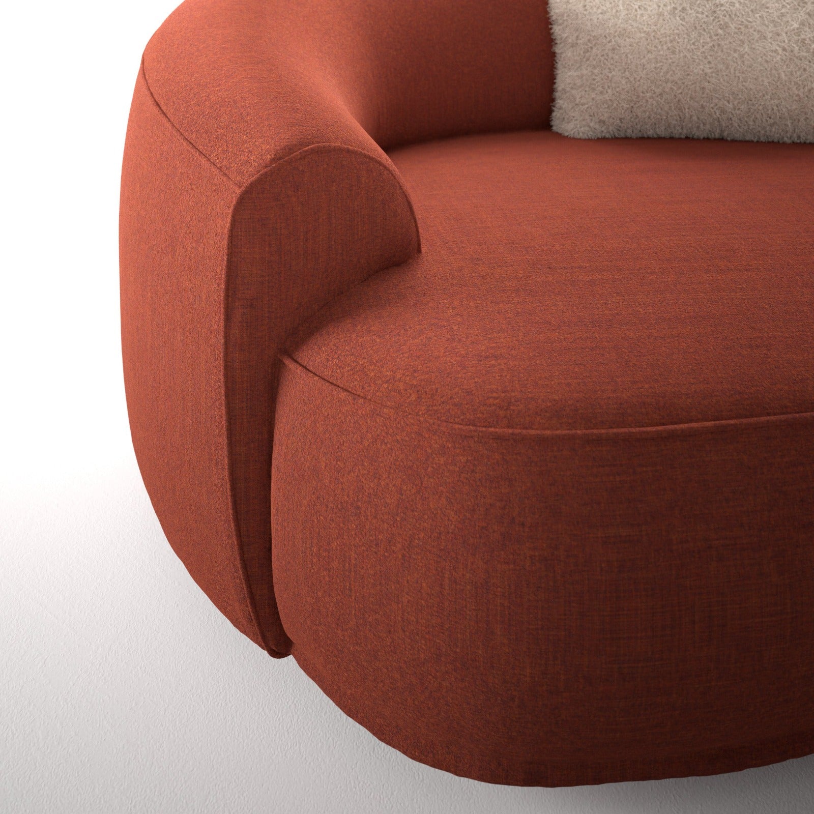 Close up of orange upholstered chair with white pillow
