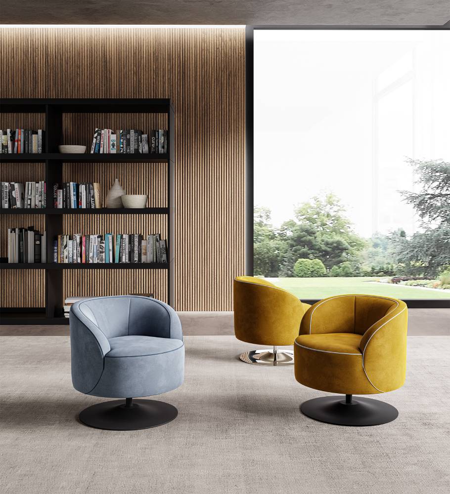 Interior view of three swivel armchairs, one blue, two yellow, near window.