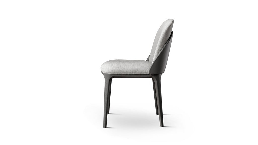 Side view upholstered dining chair light gray fabric dark frame