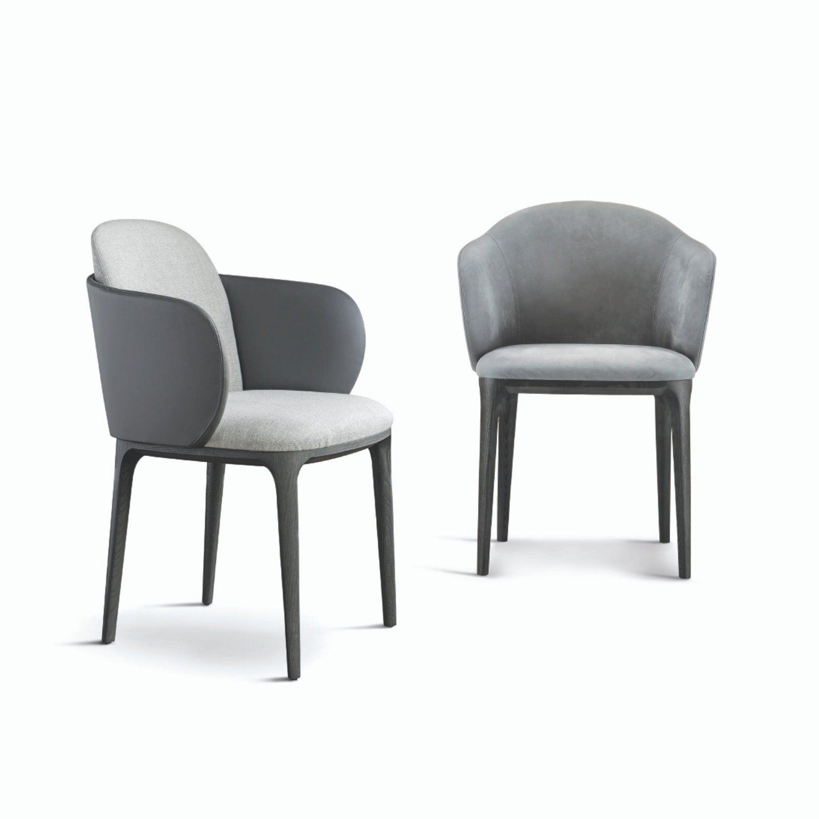 Two gray upholstered dining chairs with dark wooden legs