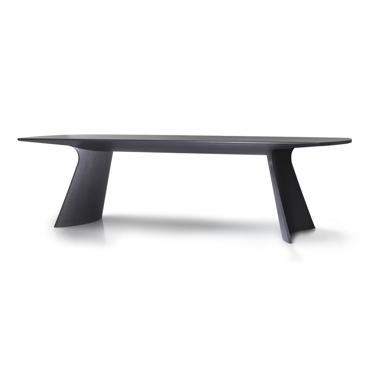 Black dining table with curved modern base on white background