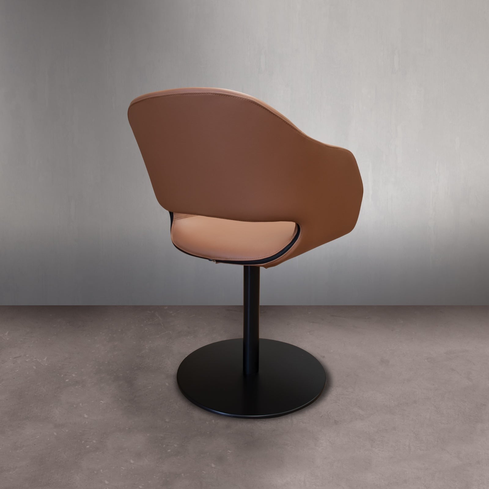 Back view brown leather swivel chair black base