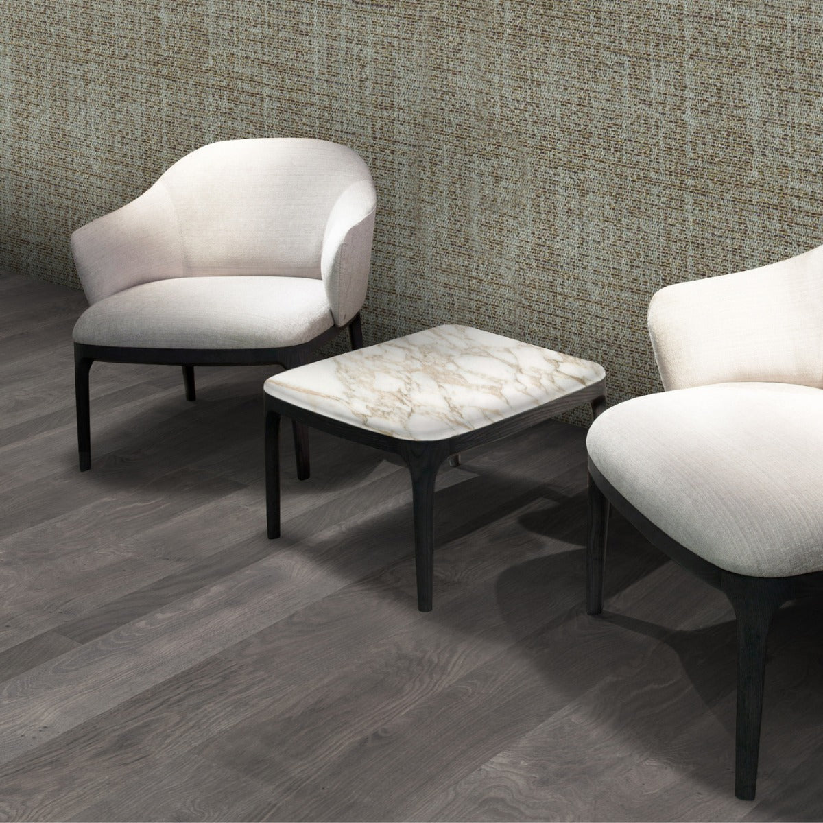 Two white upholstered chairs and marble top side table on wood floor