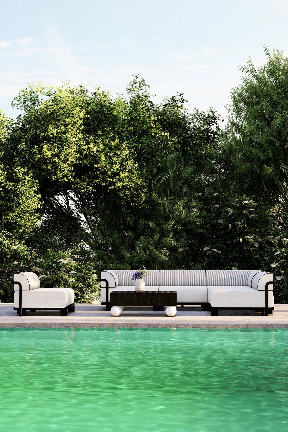 Outdoor corner seating set made from iroko wood with white cushions and black piping, placed beside a pool.