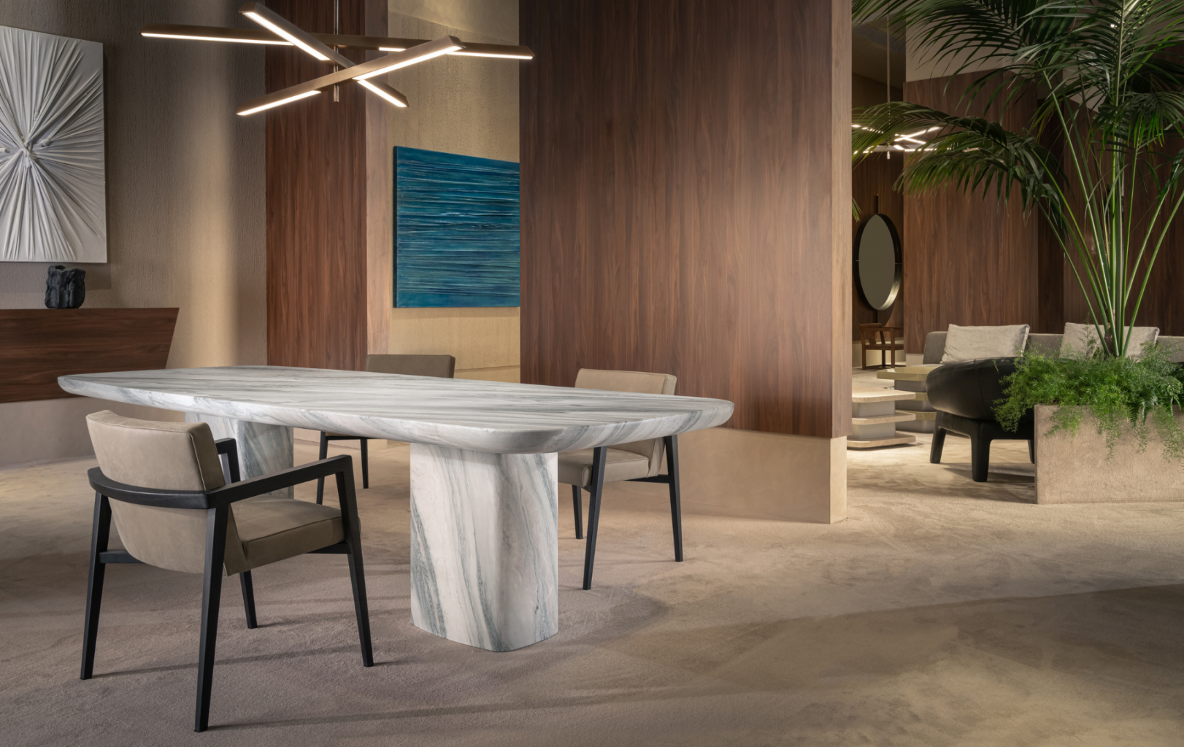 View of modern dining room with marble table and chairs, wood paneling, and plants.