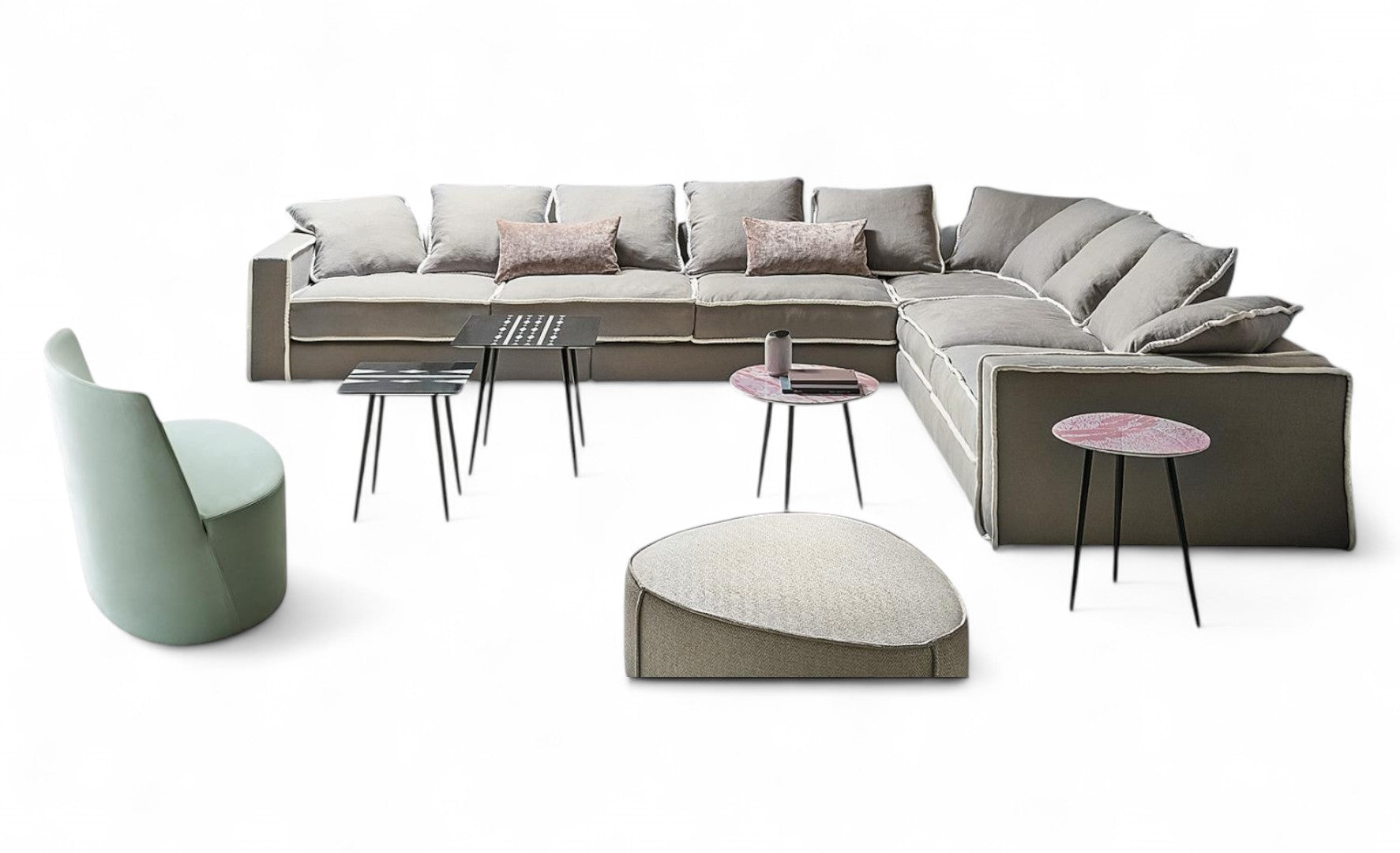 View of gray sectional sofa, green chair, four side tables, ottoman.