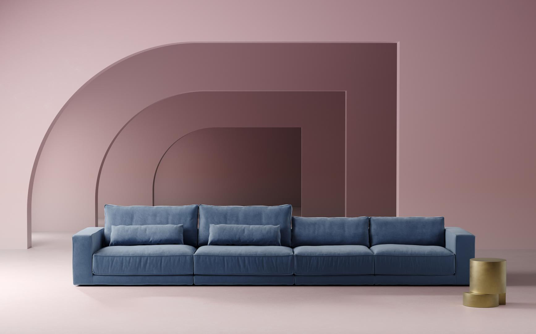  Modern living room featuring a luxurious blue modular sofa against a geometric pink backdrop. The sofa is a key furniture piece, offering comfort and style. A gold side table adds a touch of elegance. #modernfurniture #modularsofa #livingroomdecor