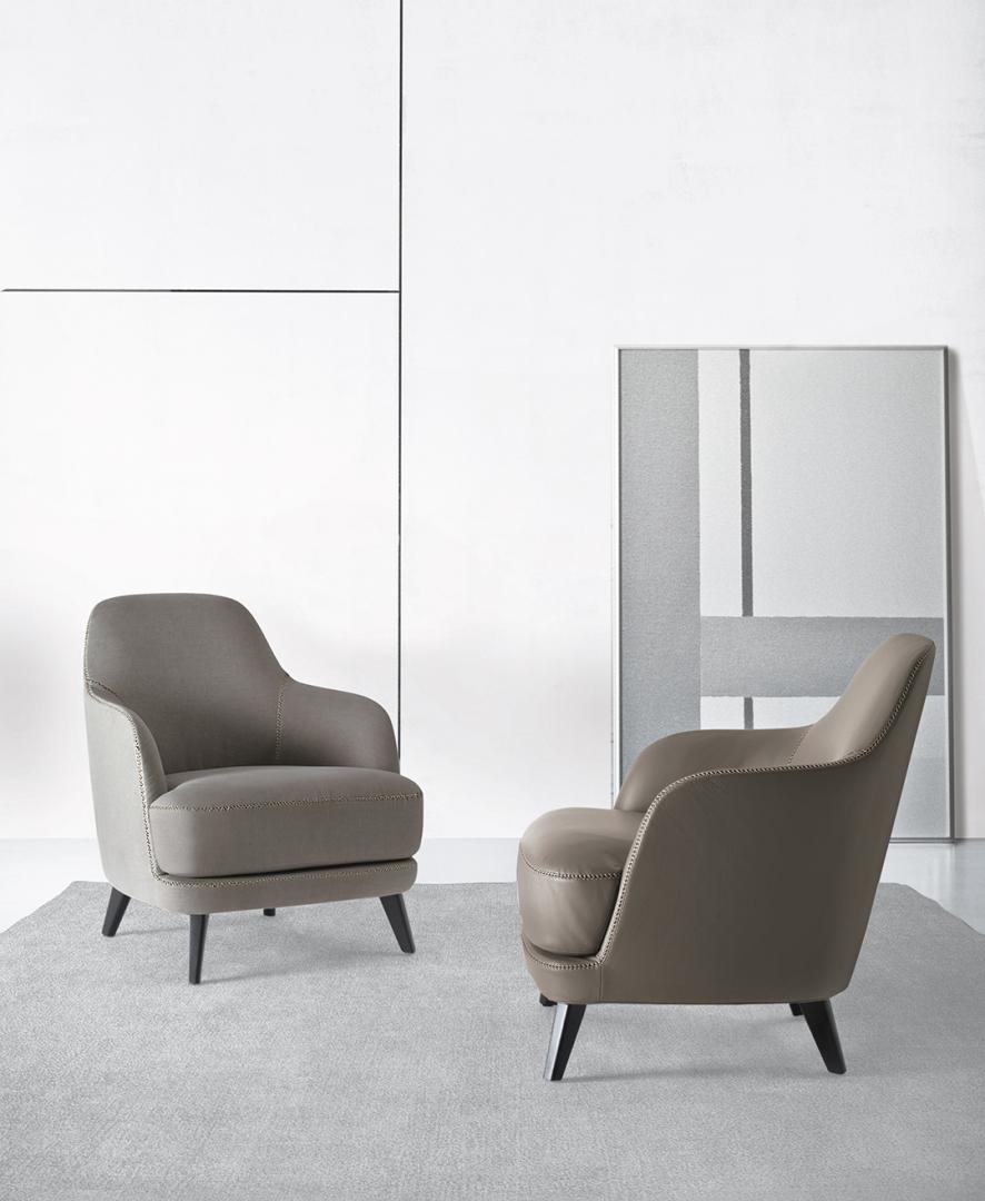  Interior with two Liz armchairs by Casamilano featuring sleek silhouettes, premium upholstery, and refined details for modern living