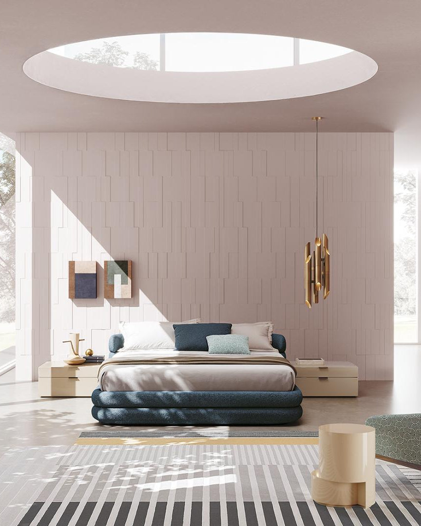  Modern minimalist bedroom featuring a low-profile bed, unique lighting, striped rug, and the patterned Casamilano Elton armchair