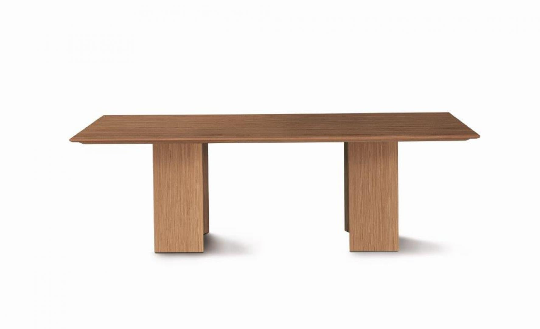  Front view of the Casamilano Karl dining table. A modern, light wood, rectangular table perfect for dining and entertaining.