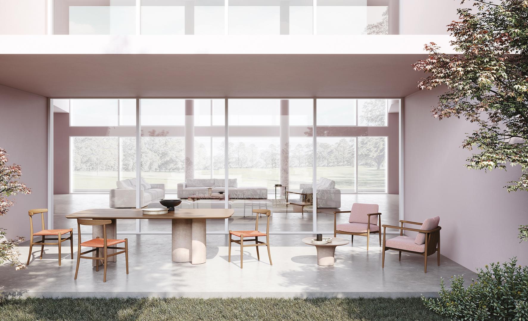  Modern open-concept living space with Casamilano Virgola IN & OUTDOOR dining table, chairs, sofa, and coffee table. Minimalist design, natural light