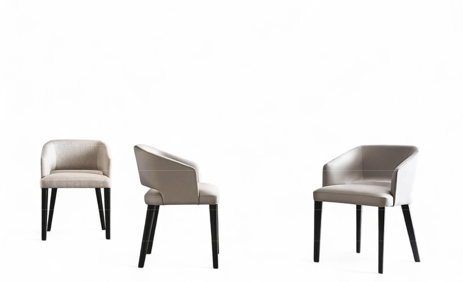 Three upholstered dining chairs with dark wooden legs on white background