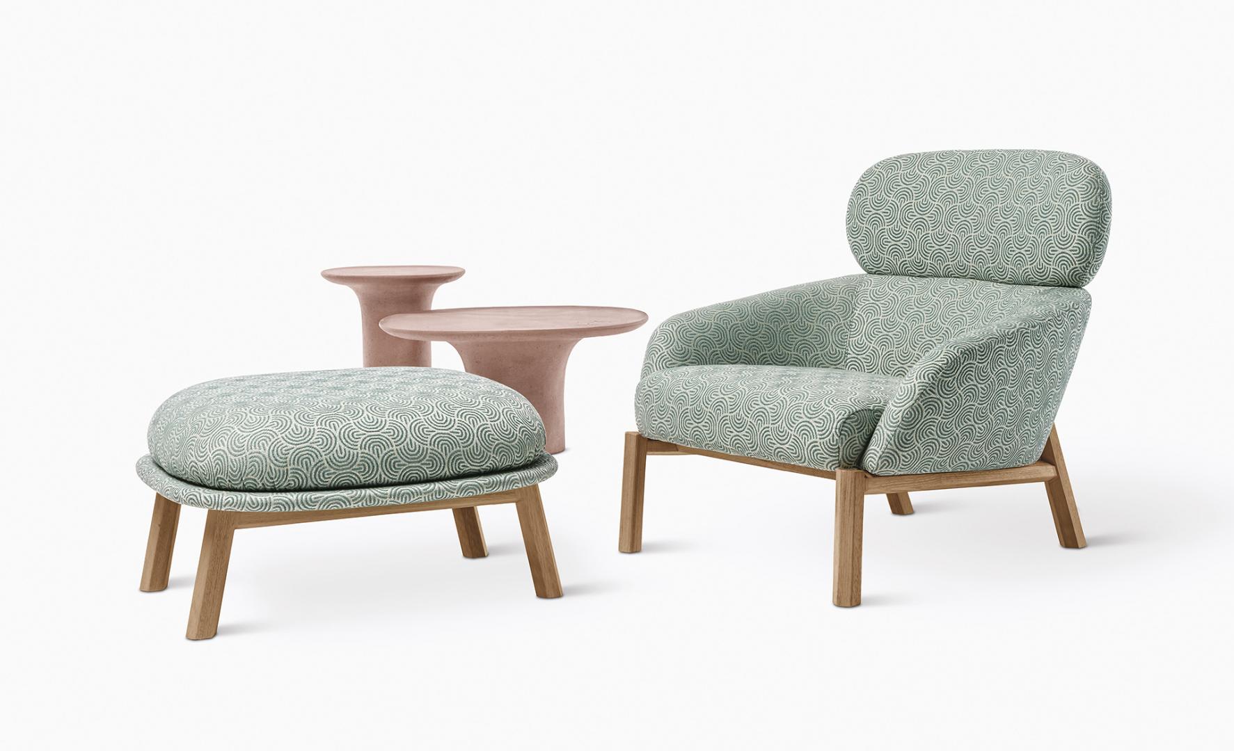  Modern living room featuring a patterned armchair, ottoman, and two side tables by Casamilano Callas IN & OUTDOOR